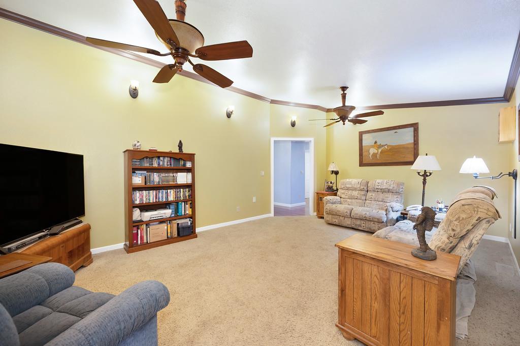 12156 Scott Grant Road Marysville, CA 95901 - Photo 38 of 77 a bedroom with furniture and a flat screen tv