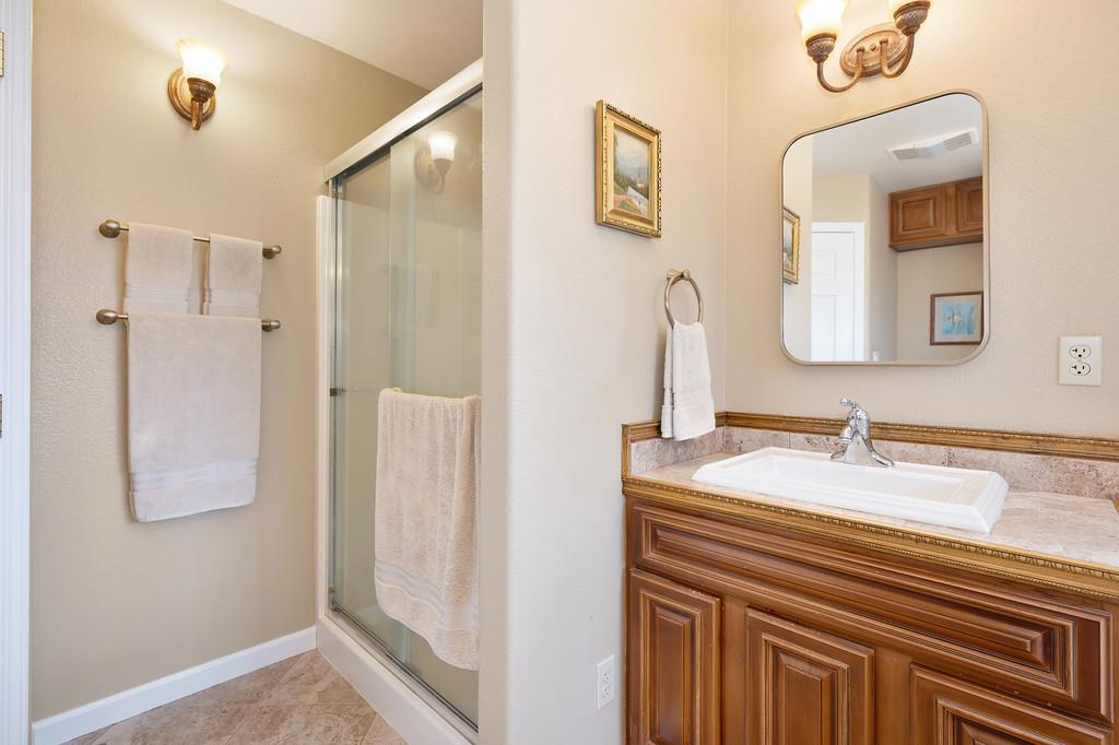 12156 Scott Grant Road Marysville, CA 95901 - Photo 44 of 77 a bathroom with a sink and a mirror