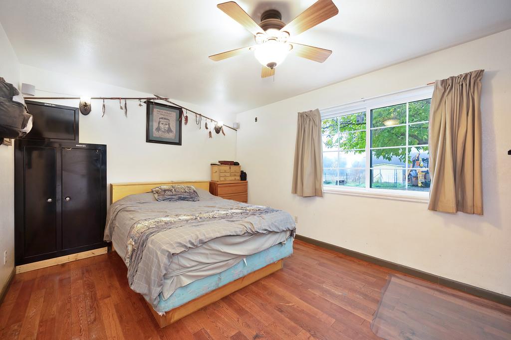 12156 Scott Grant Road Marysville, CA 95901 - Photo 48 of 77 a bedroom with a bed and a large window