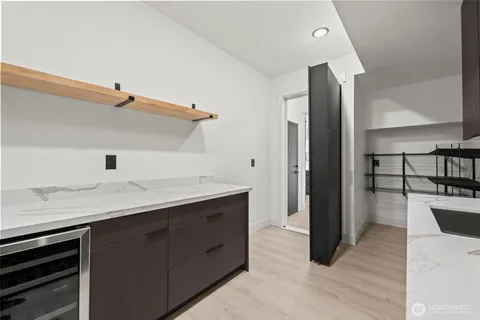 a bathroom with a toilet a sink and a mirror