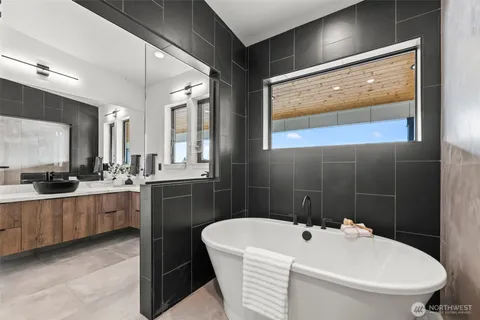 a living room with furniture and large windows