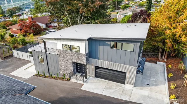 an outdoor space with seating area and trees around