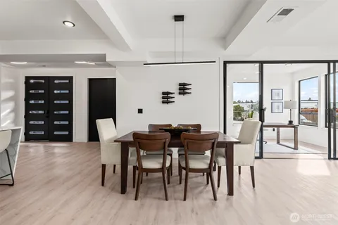 a kitchen with stainless steel appliances kitchen island granite countertop a refrigerator and microwave