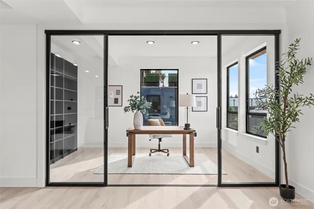 a living room with furniture and wooden floor