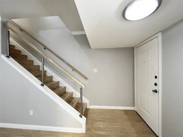 a kitchen with granite countertop a sink and a stove top oven