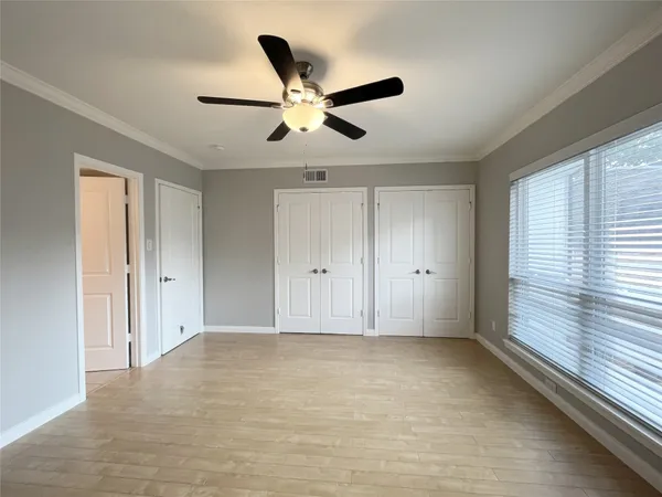 a bathroom with a toilet a sink a tub and mirror