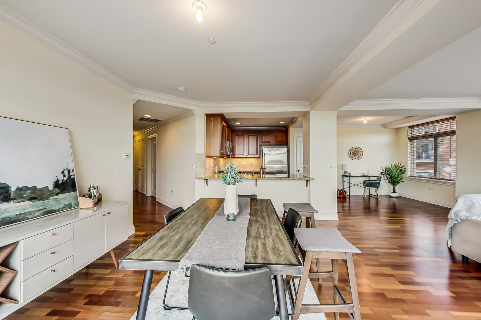 600 West Touhy Avenue, Unit 303 Park Ridge, IL 60068 - Photo 12 of 32 a living room with dining room and wooden floor