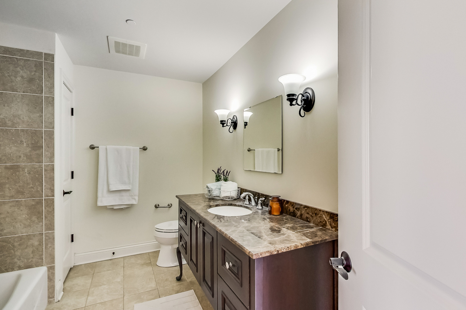 600 West Touhy Avenue, Unit 303 Park Ridge, IL 60068 - Photo 27 of 32 a bathroom with a sink a mirror and a shower