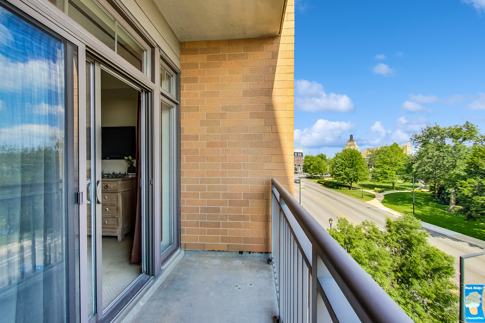 600 West Touhy Avenue, Unit 303 Park Ridge, IL 60068 - Photo 29 of 32 a view of balcony with wooden floor and fence