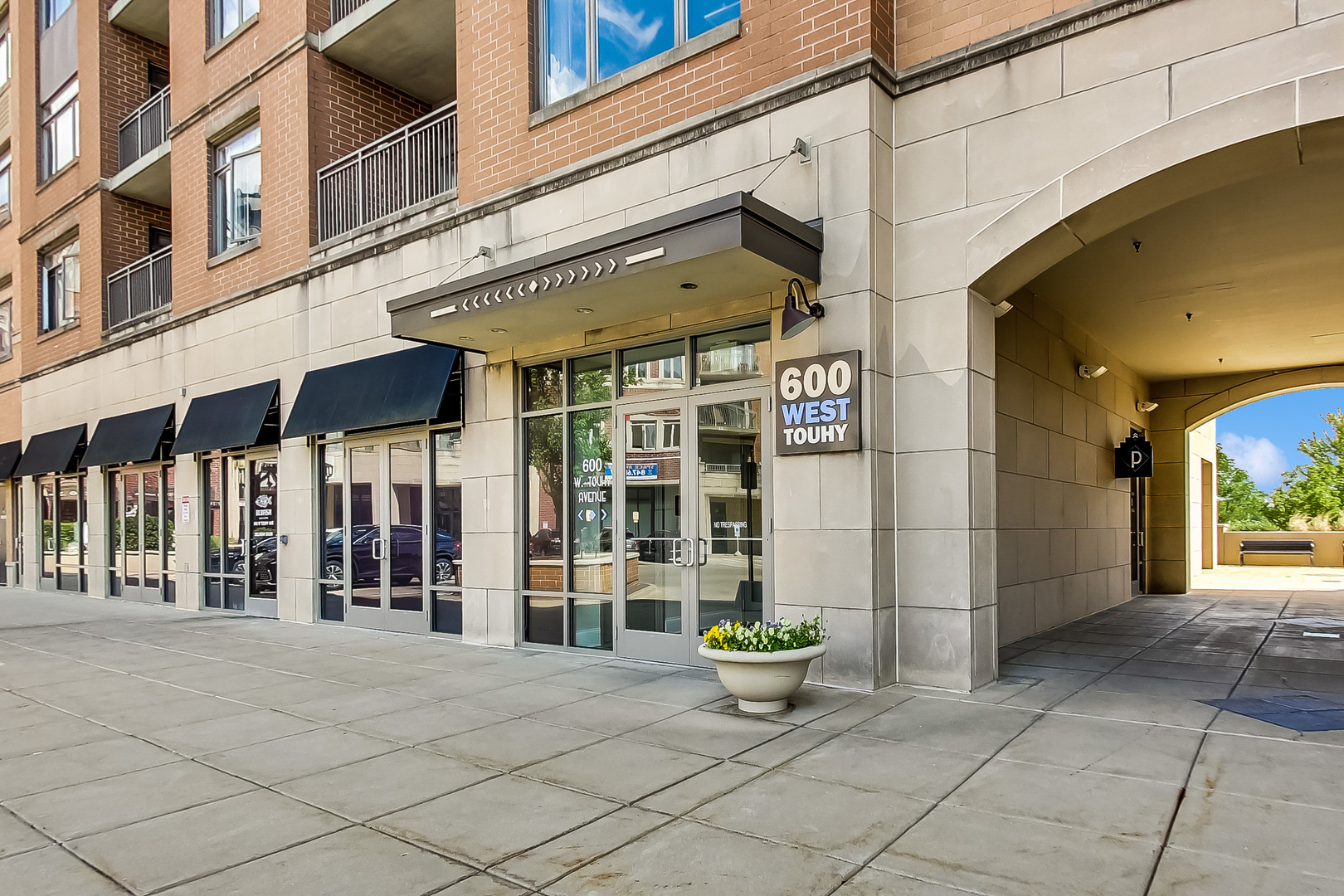 600 West Touhy Avenue, Unit 303 Park Ridge, IL 60068 - Photo 4 of 32 a view of a building with glass windows