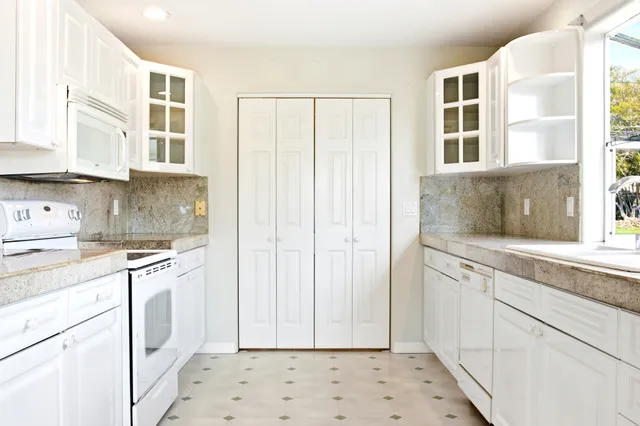 a bedroom with a bed and a ceiling fan