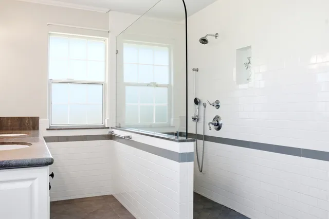a kitchen with a sink cabinets and window