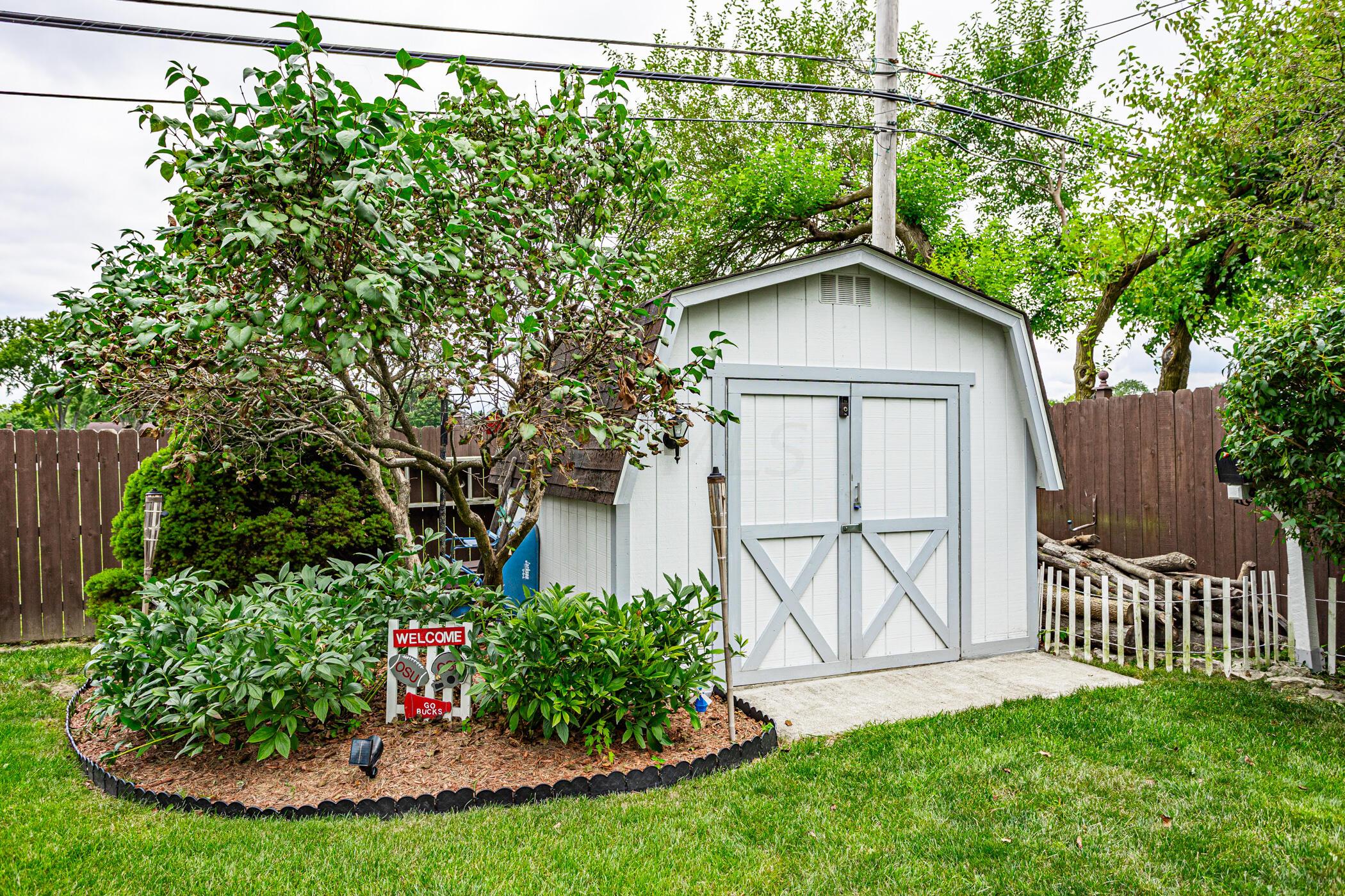 6330 Faircrest Road Columbus, OH 43229 - Photo 7 of 52 Large Storage shed with electric and lighting.