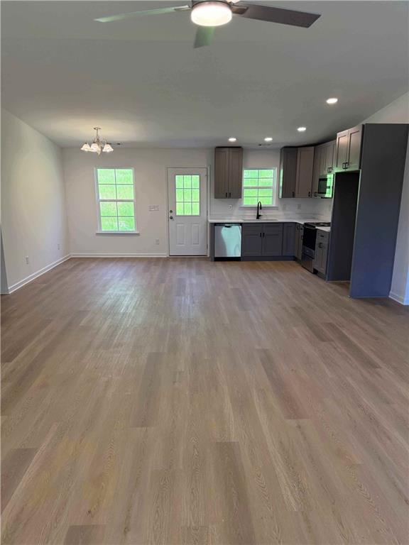 81 Loper Lane Ellijay, GA 30540 - Photo 13 of 29 an empty room with windows and fireplace