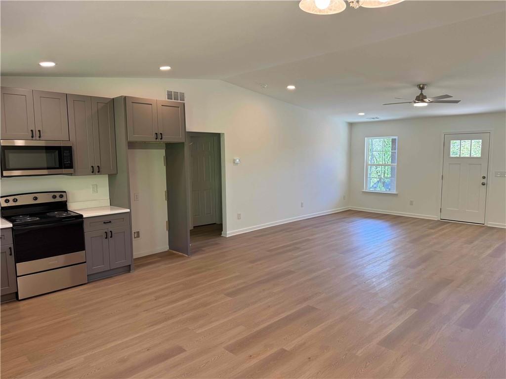 81 Loper Lane Ellijay, GA 30540 - Photo 15 of 29 a kitchen with stainless steel appliances a refrigerator and a stove top oven
