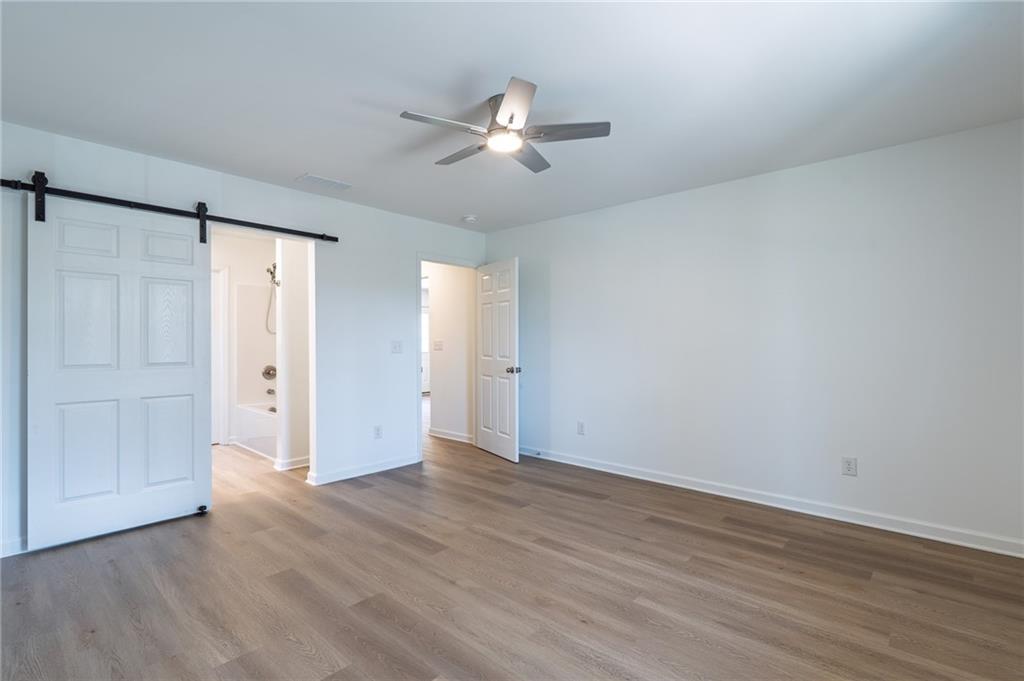81 Loper Lane Ellijay, GA 30540 - Photo 19 of 29 a view of an empty room with wooden floor