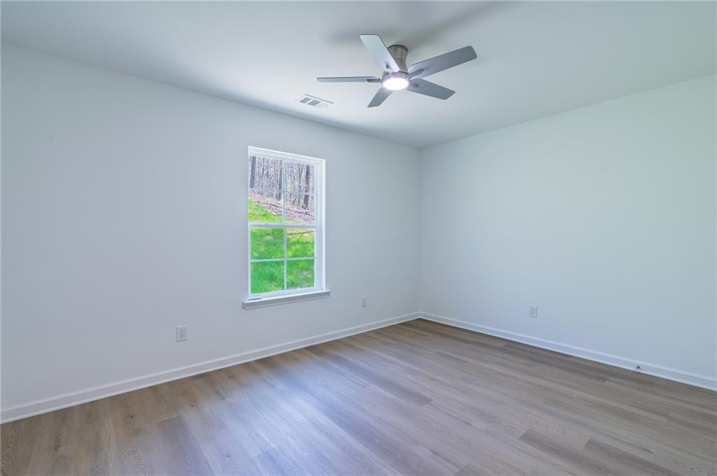 81 Loper Lane Ellijay, GA 30540 - Photo 24 of 29 wooden floor in an empty room with a window