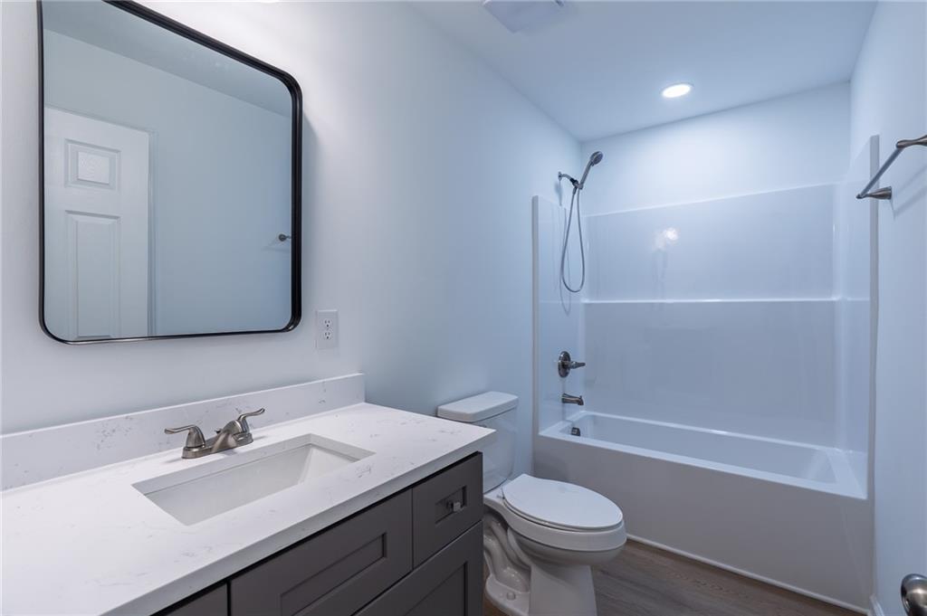81 Loper Lane Ellijay, GA 30540 - Photo 26 of 29 a bathroom with a sink toilet and shower