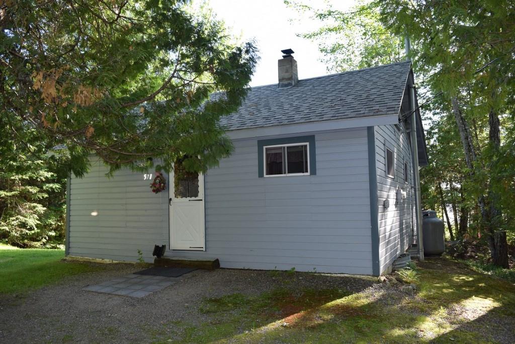 571 Phinney Farm Road Lincoln, ME 04457 - Photo 6 of 30 Road side view of cottage as you...