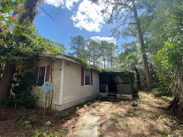 a backyard of a house with lots of green space