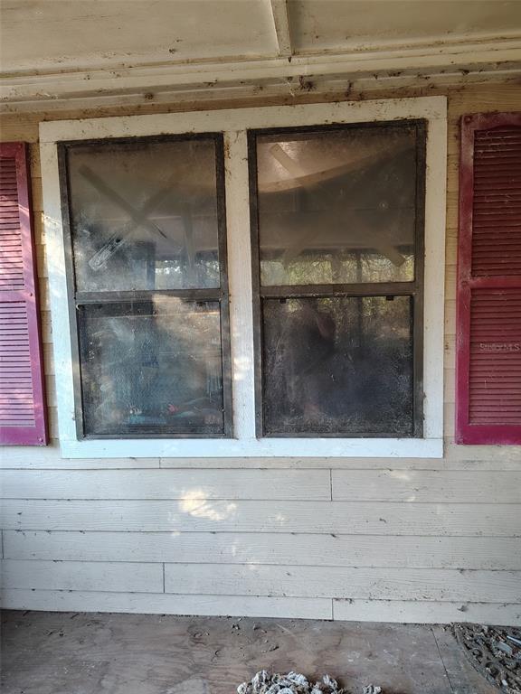 7801 Northeast 192nd Place Citra, FL 32113 - Photo 2 of 32 a window with a glass door