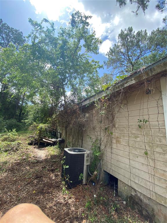 7801 Northeast 192nd Place Citra, FL 32113 - Photo 27 of 32 a backyard of a house with table and chairs