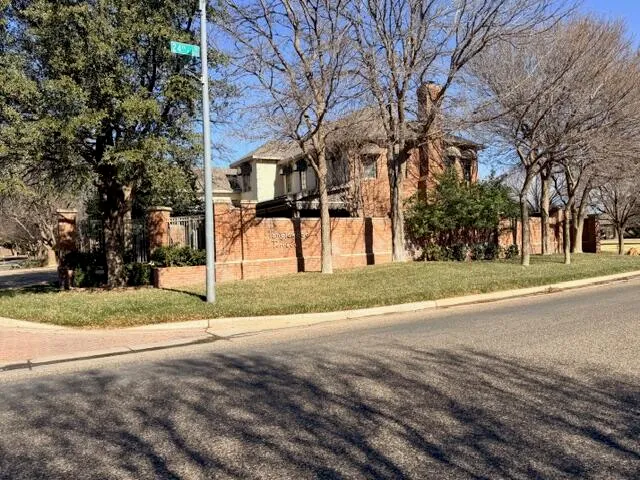 a view of road with large trees