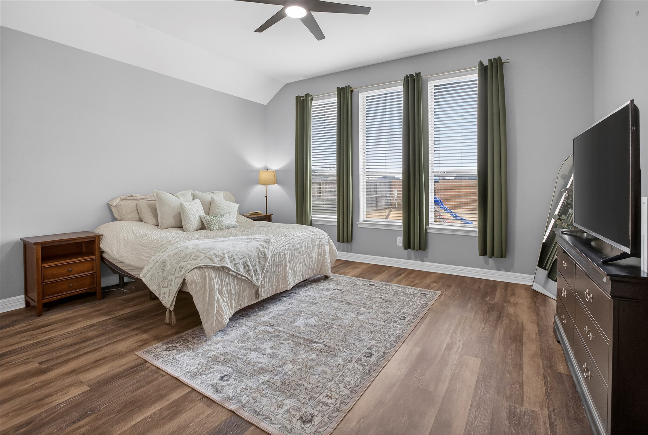 9702 Inwood Circle Baytown, TX 77523 - Photo 18 of 34 Spacious primary bedroom with natural light that fills the room.