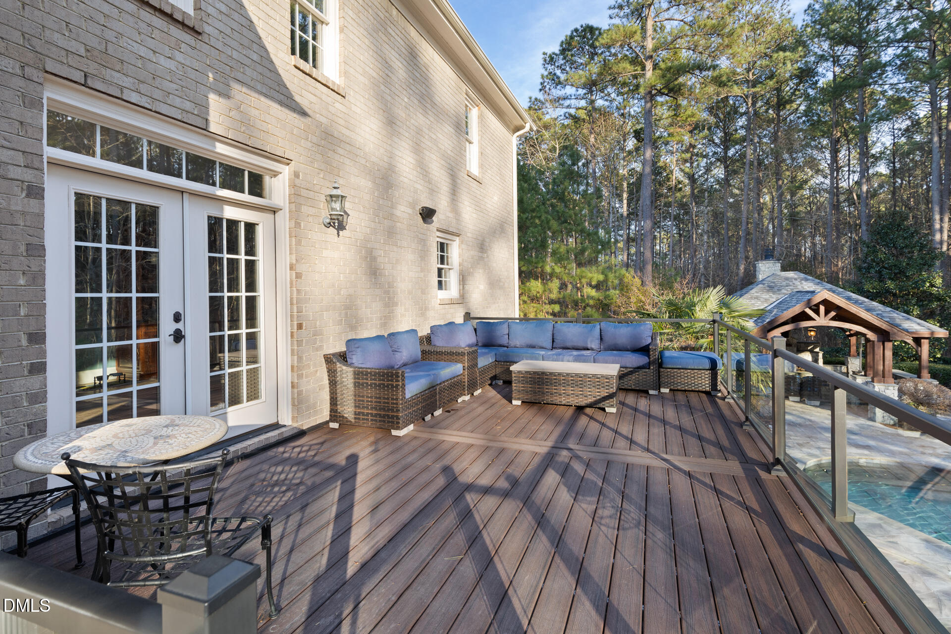 112 Winding Ridge Road Durham, NC 27713 - Photo 40 of 84 a view of a patio with table and chairs with wooden floor and fence