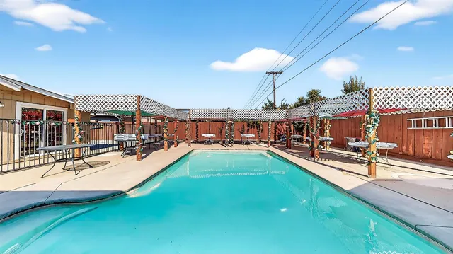 a view of a swimming pool with a patio