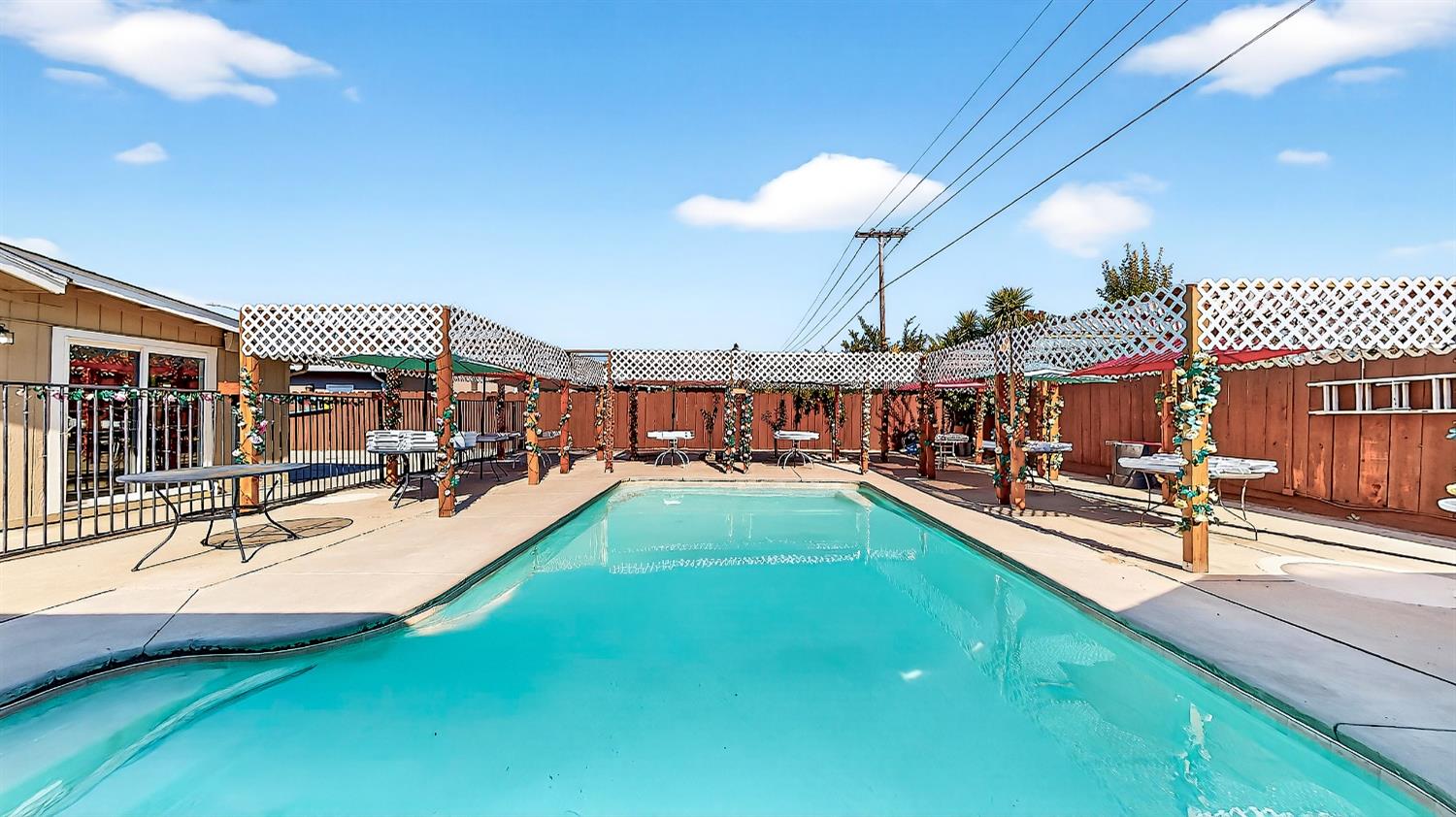 2720 Brooks Court Turlock, CA 95382 - Photo 2 of 50 a view of a swimming pool with a patio