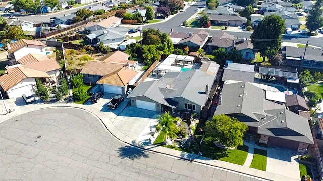 an aerial view of residential houses with outdoor space