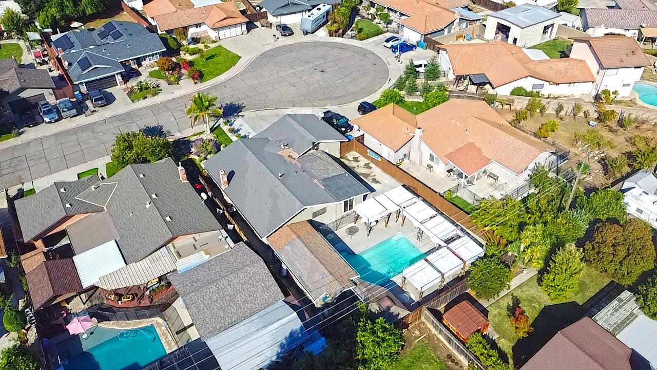 2720 Brooks Court Turlock, CA 95382 - Photo 34 of 50 an aerial view of a house with a swimming pool and outdoor space