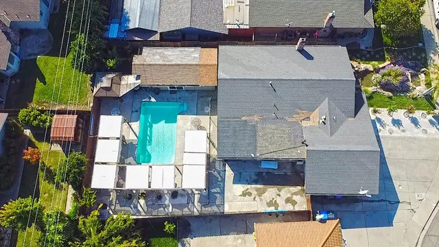 an aerial view of residential houses with outdoor space