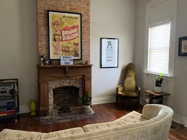 a living room with furniture and a fireplace