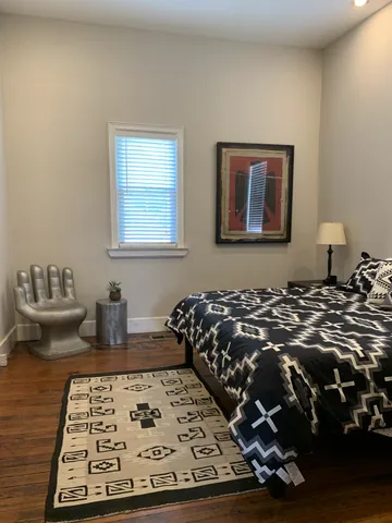 a bedroom with a bed and a couch