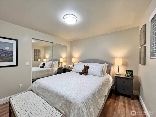 a bedroom with a bed and a lamp