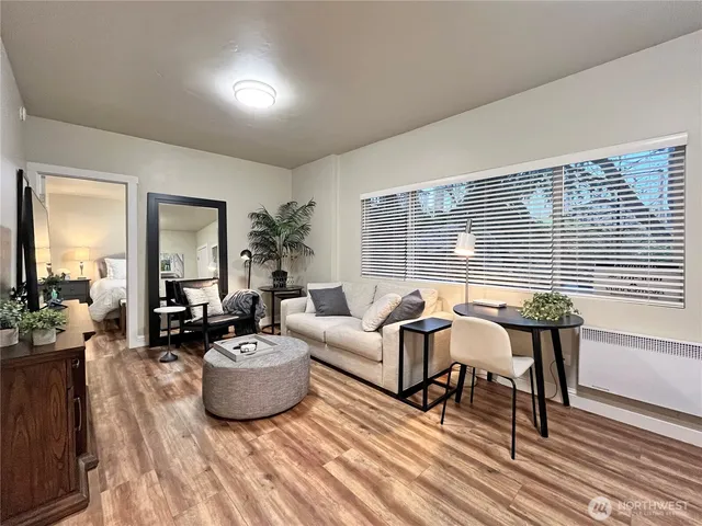 a living room with furniture and a large window