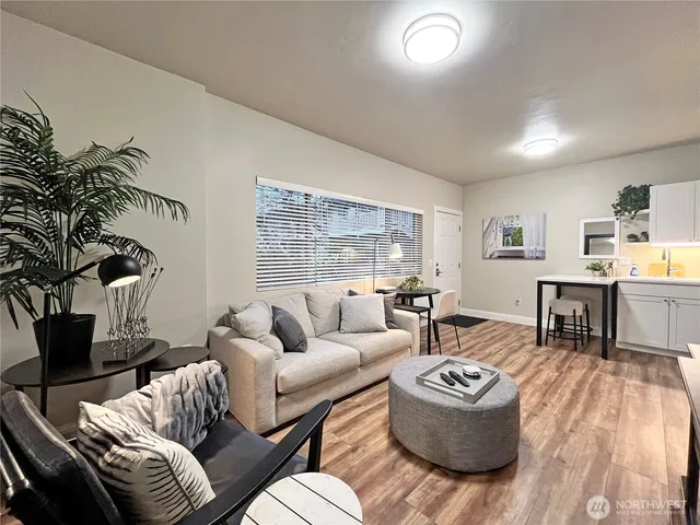a living room with furniture and a large window
