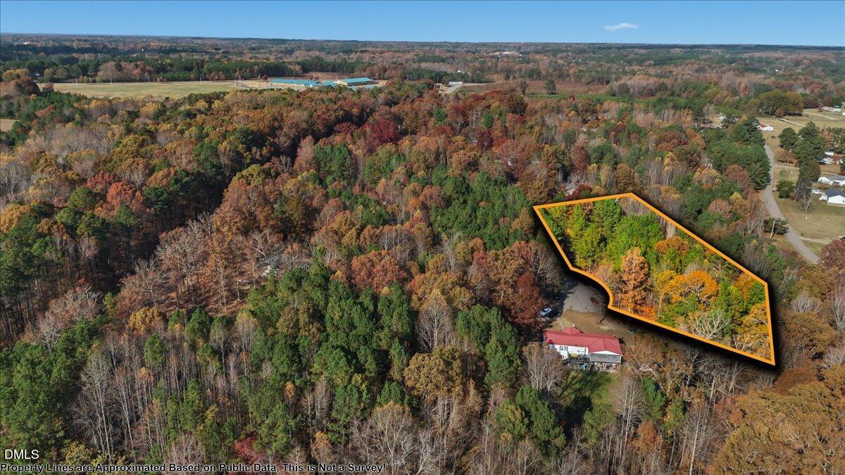 0 Ridgecrest Lane Henderson, NC 27537 - Photo 5 of 8 an aerial view of a house with a yard and lake view