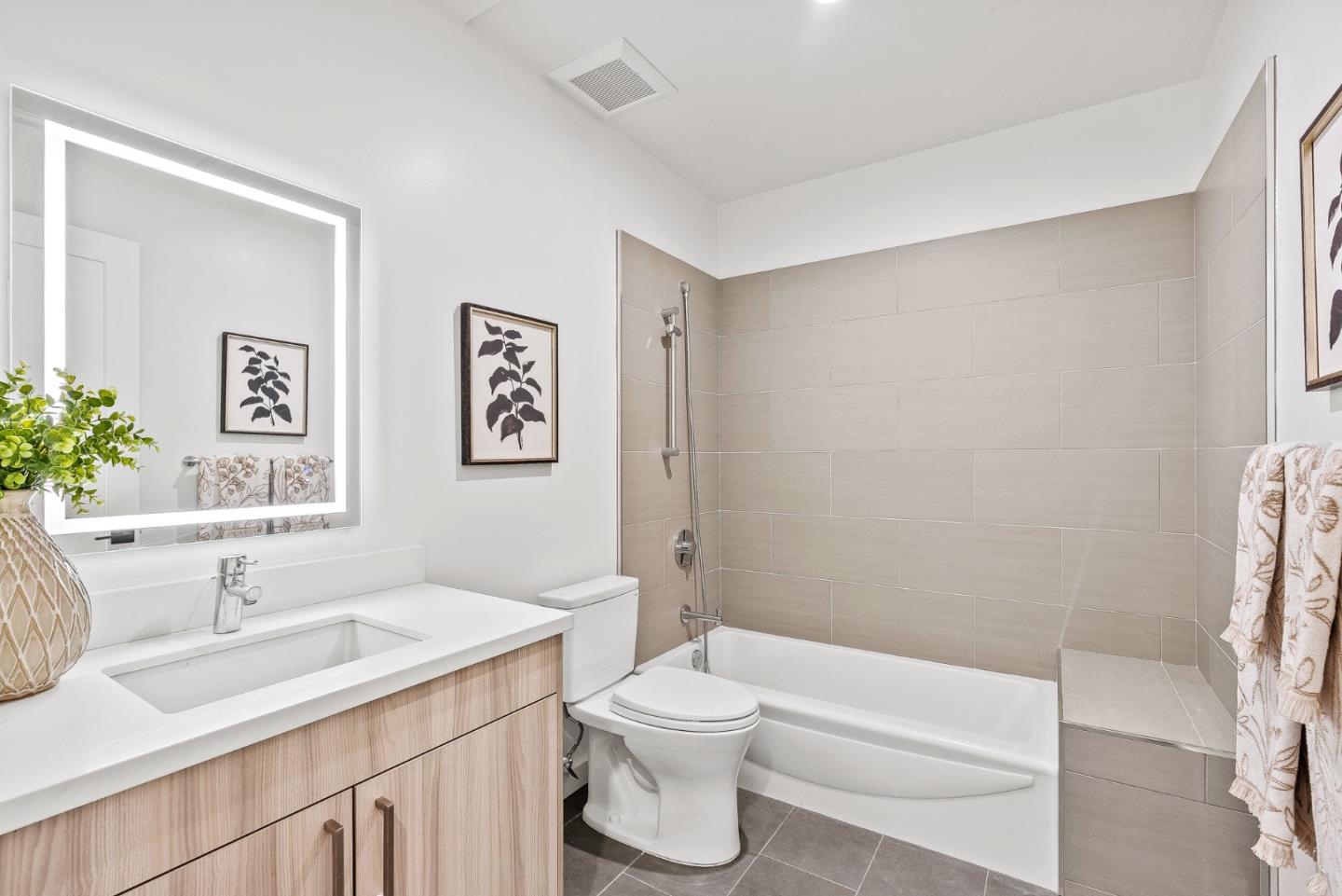 908 Woodside Road Redwood City, CA 94061 - Photo 19 of 34 a bathroom with a sink a toilet and shower