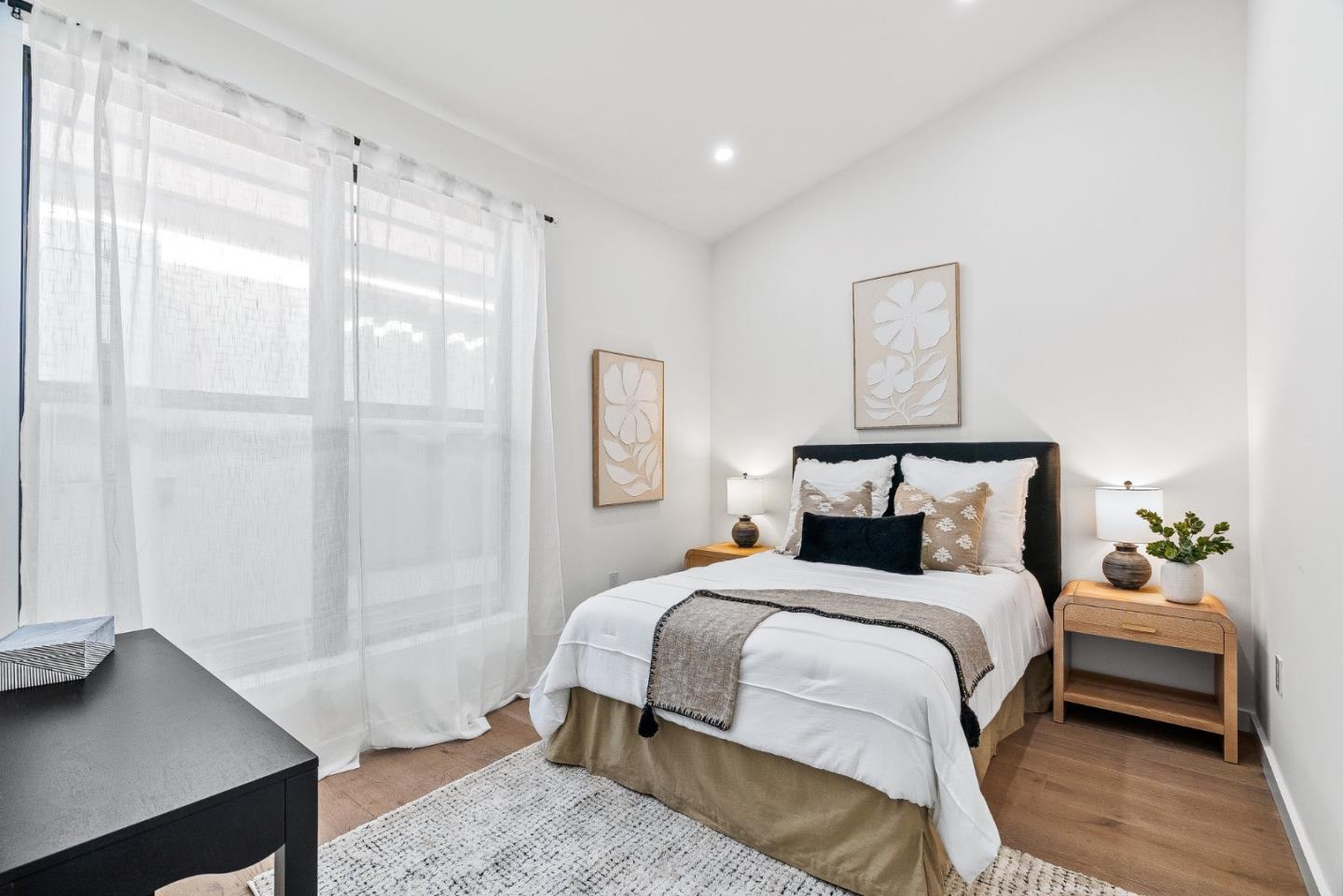 908 Woodside Road Redwood City, CA 94061 - Photo 21 of 34 a bedroom with a bed and a window
