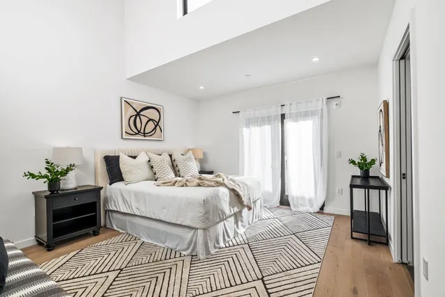 a bedroom with a bed and a couch