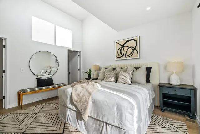 a bed room with a bed and a window