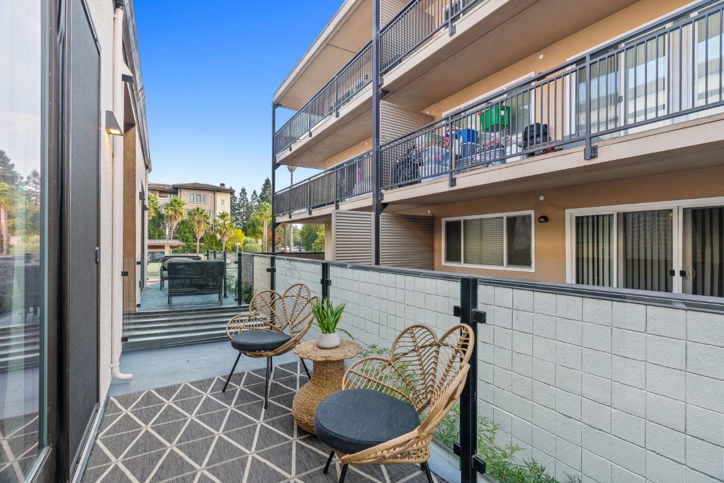 908 Woodside Road Redwood City, CA 94061 - Photo 9 of 34 a view of a patio with table and chairs and potted plants