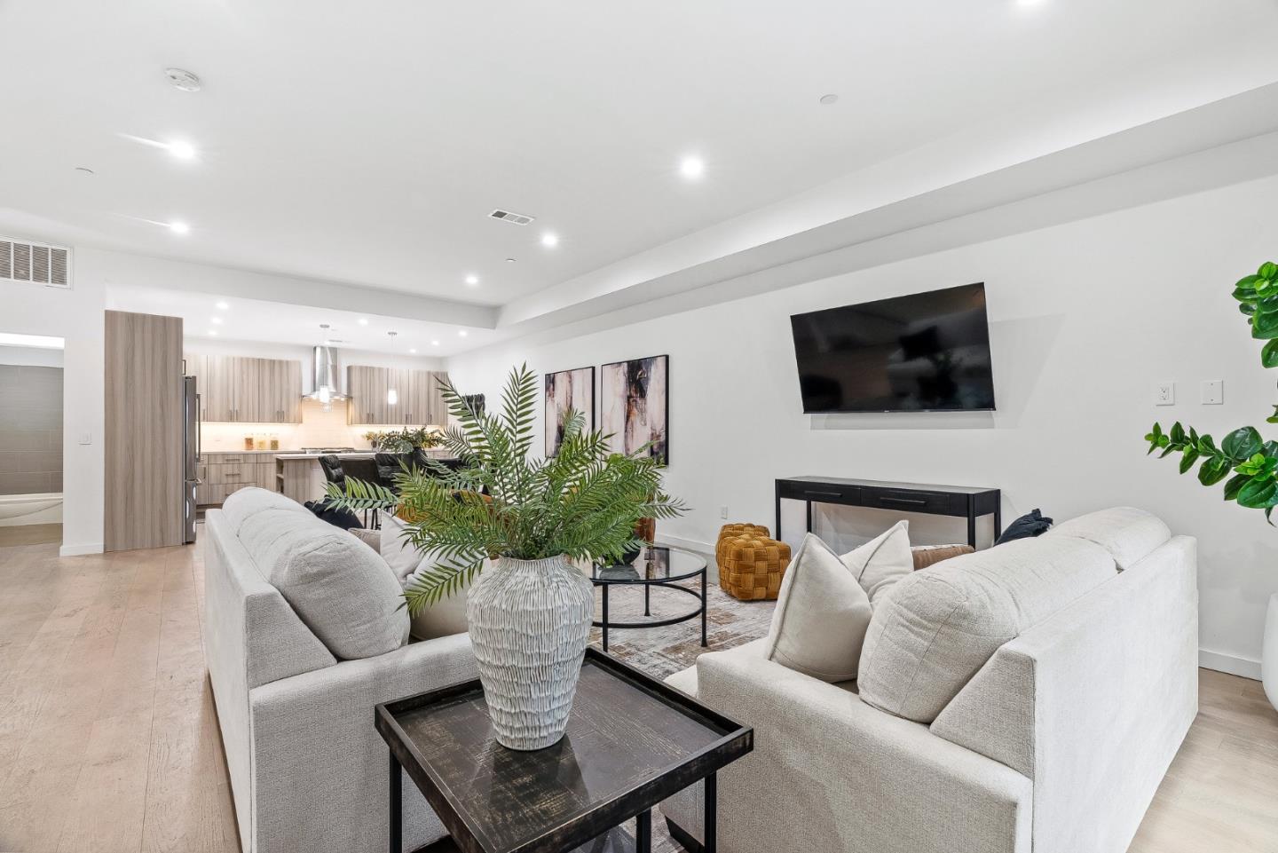 908 Woodside Road Redwood City, CA 94061 - Photo 10 of 34 a living room with furniture and a flat screen tv