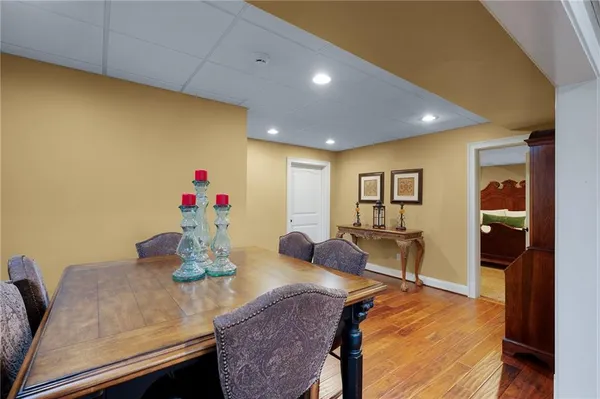 a kitchen with stainless steel appliances granite countertop sink stove refrigerator and cabinets