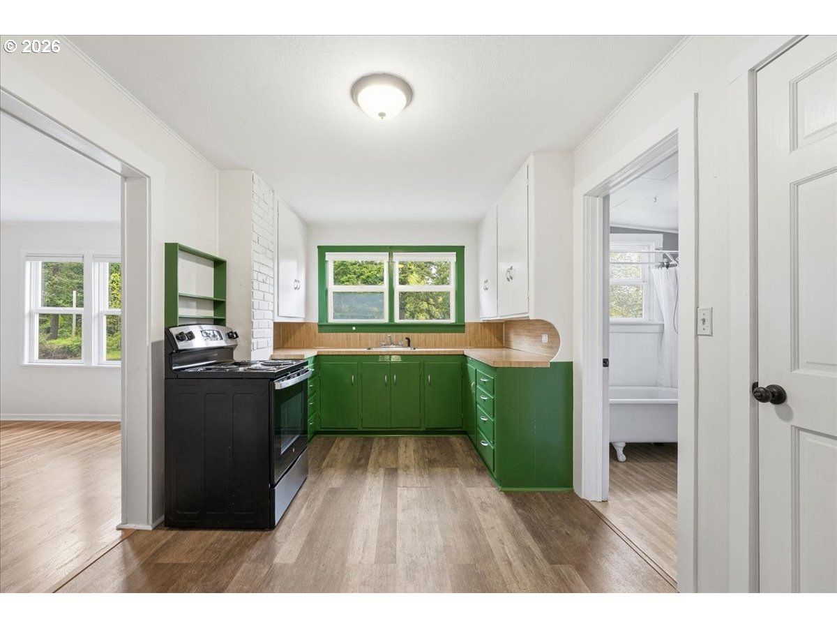 51 Wilkinson Street Carson, WA 98610 - Photo 16 of 37 a living room with furniture and a wooden floor