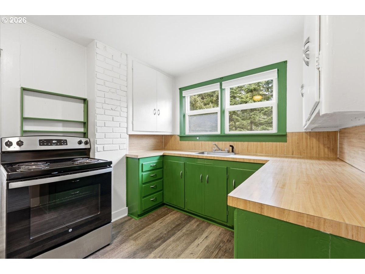 51 Wilkinson Street Carson, WA 98610 - Photo 17 of 37 a kitchen with a stove a sink and a window