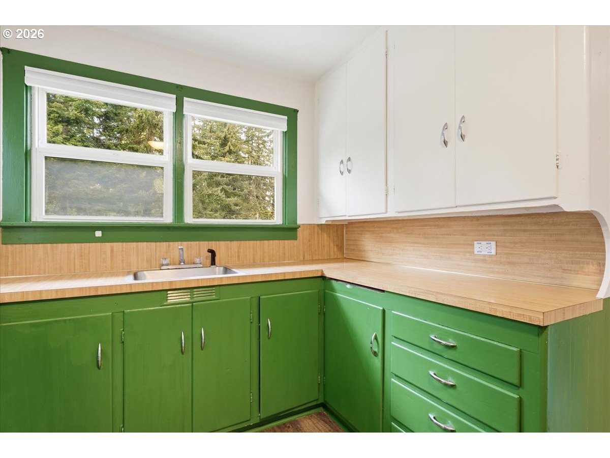 51 Wilkinson Street Carson, WA 98610 - Photo 19 of 37 a kitchen with a sink and cabinets